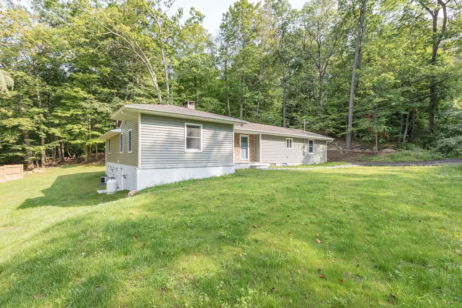 Green home with wraparound rear patio