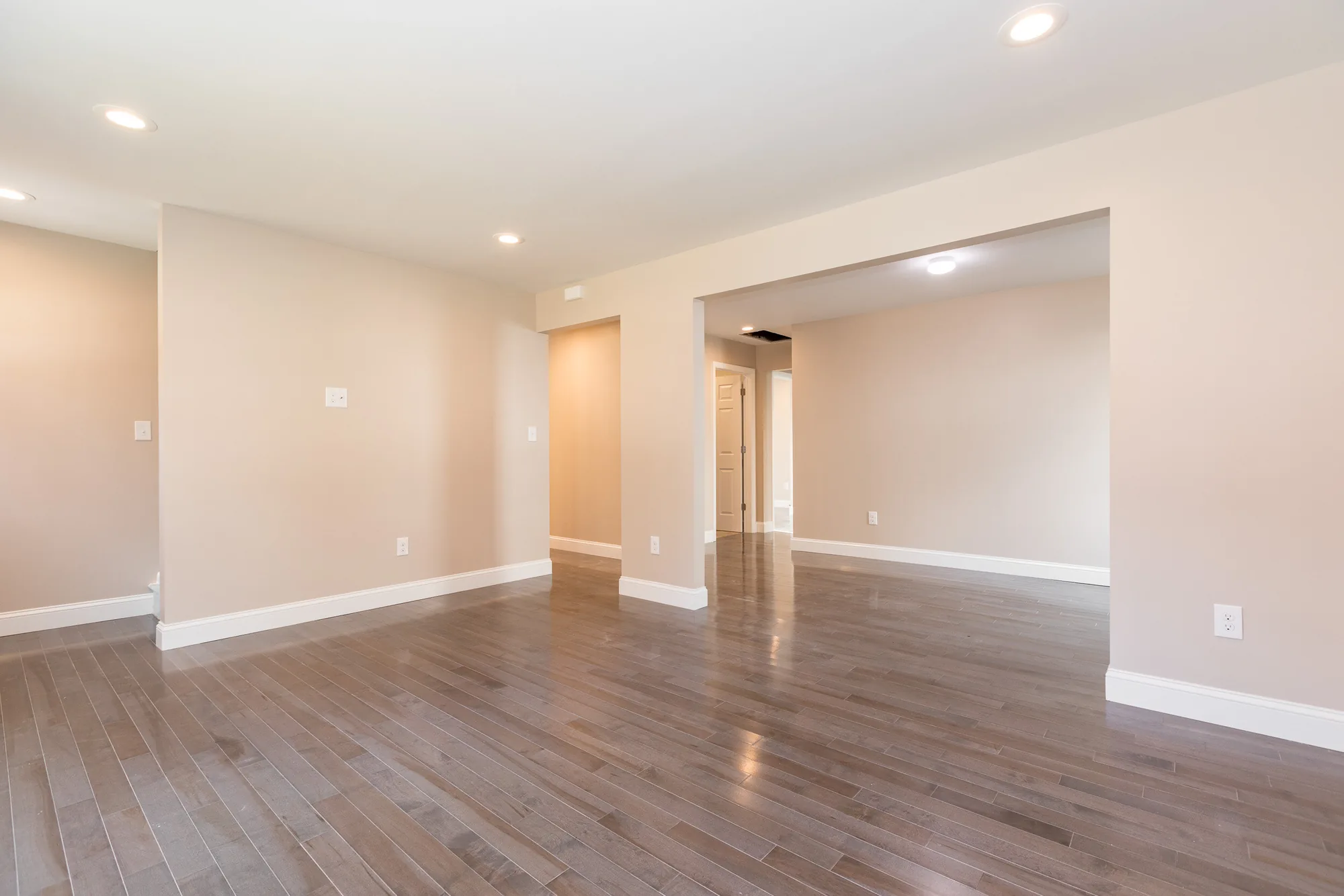 Vaulted living room with cable-rail staircase
