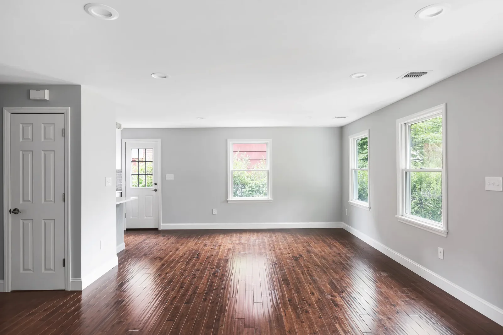 Bedroom with paneled doors and window