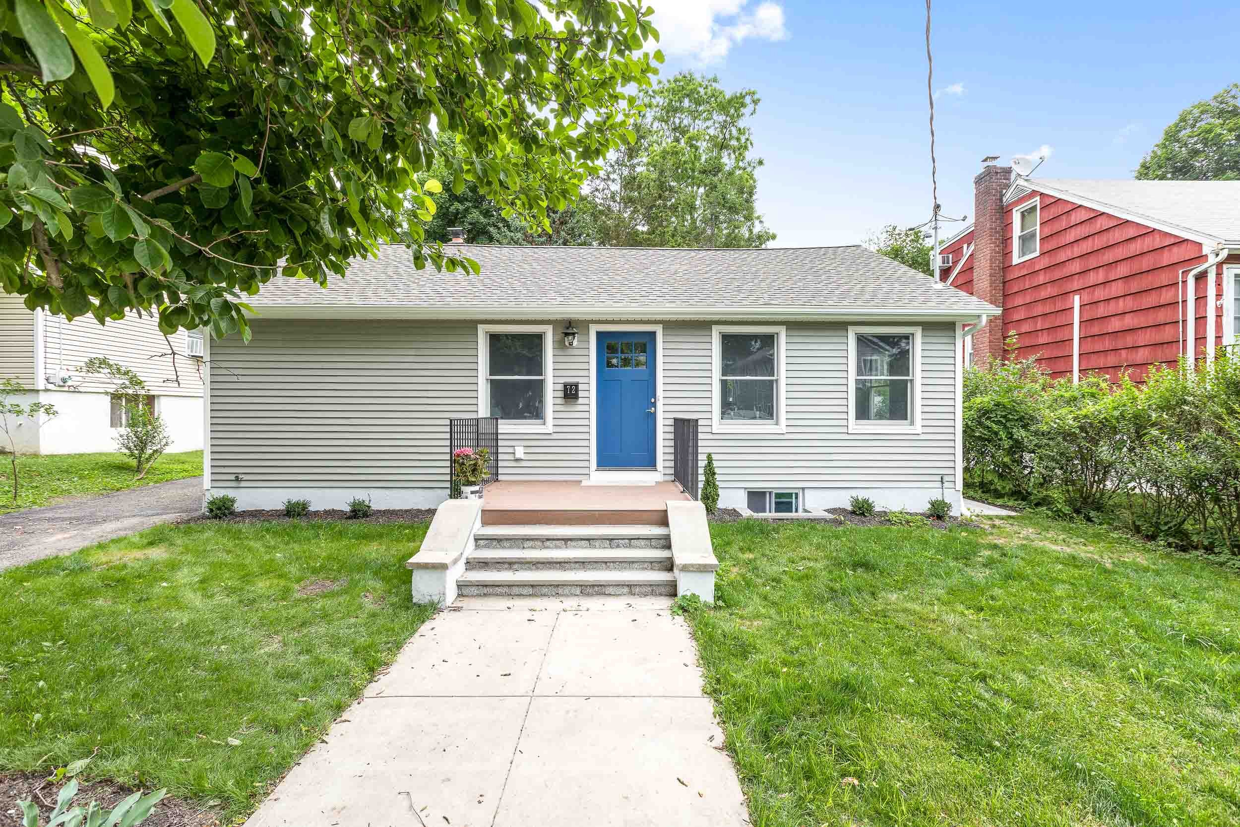 Renovated ranch exterior with blue door