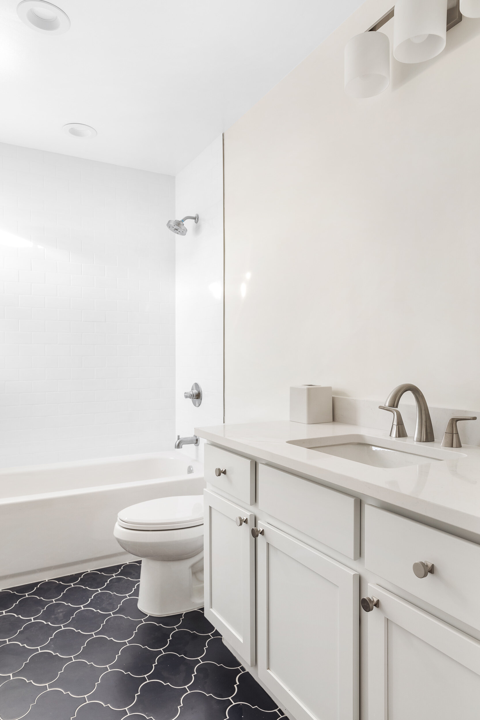 White bathroom with patterned floor