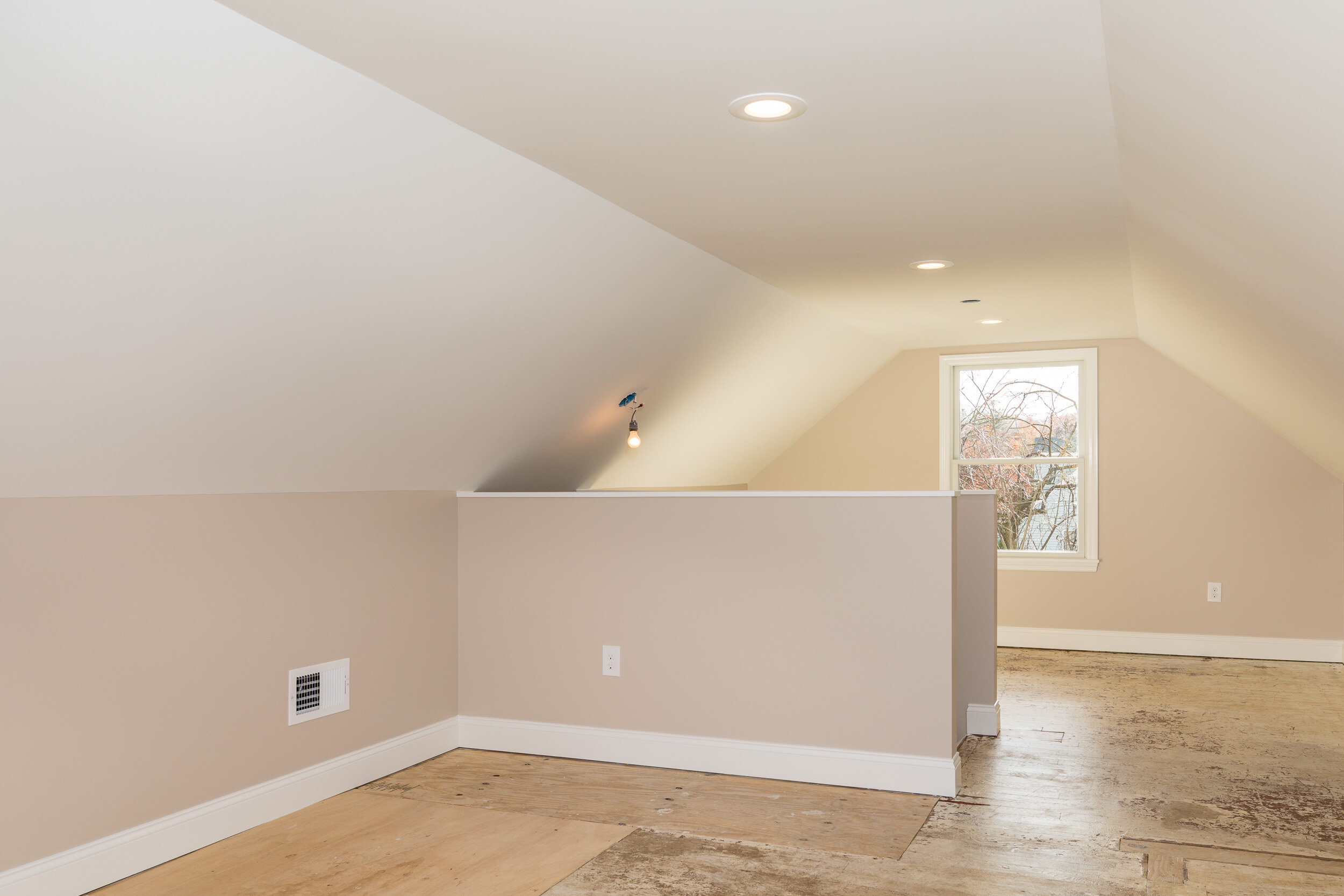 Finished attic bonus room with a vaulted ceiling and dormer window