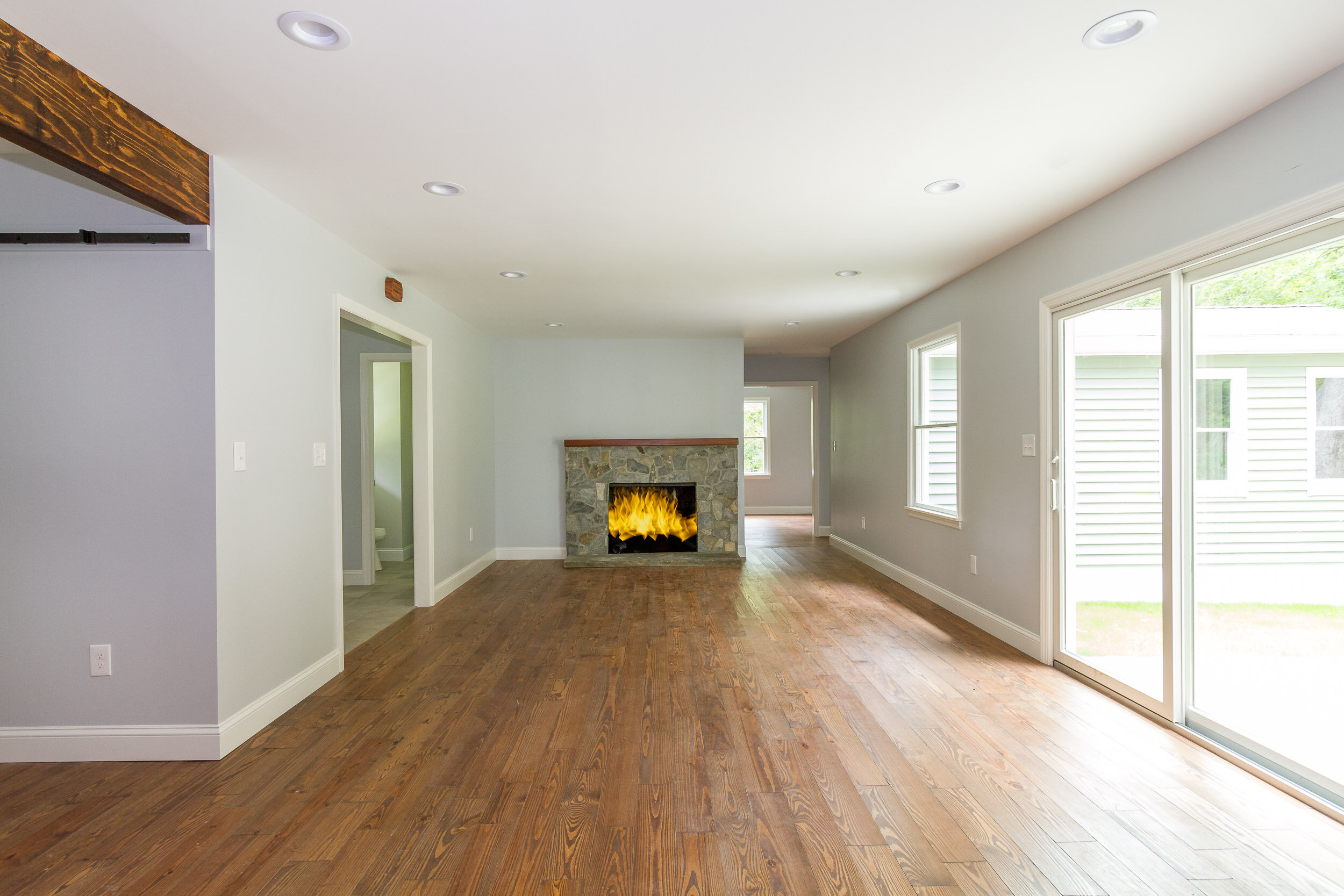 Living room with stone fireplace