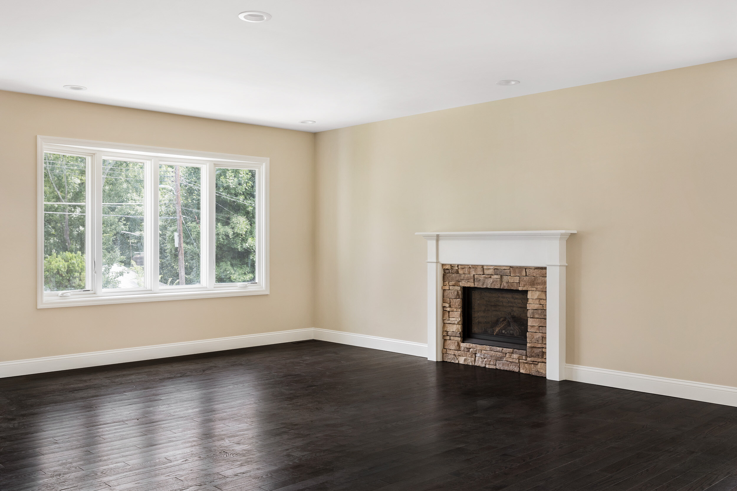 Opened-up living space with skylight and blue staircase