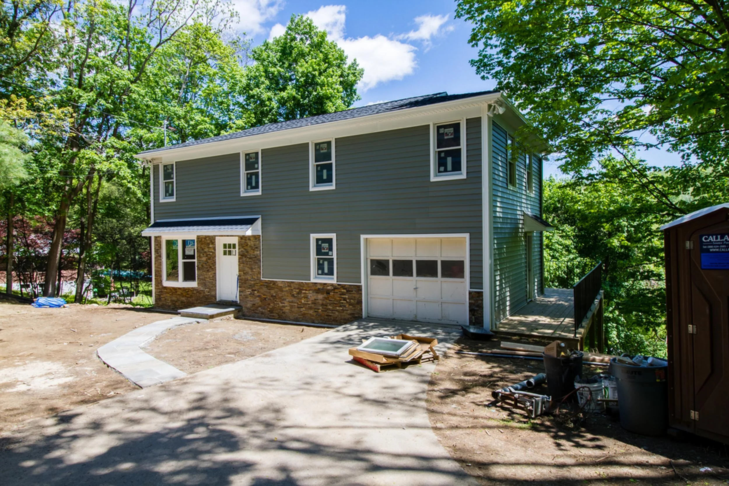 Front exterior of the remodeled modern farmhouse at 100 Morningside Dr