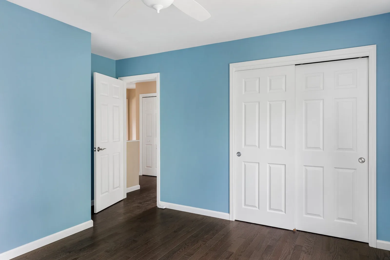 Bedroom with sliding closet doors
