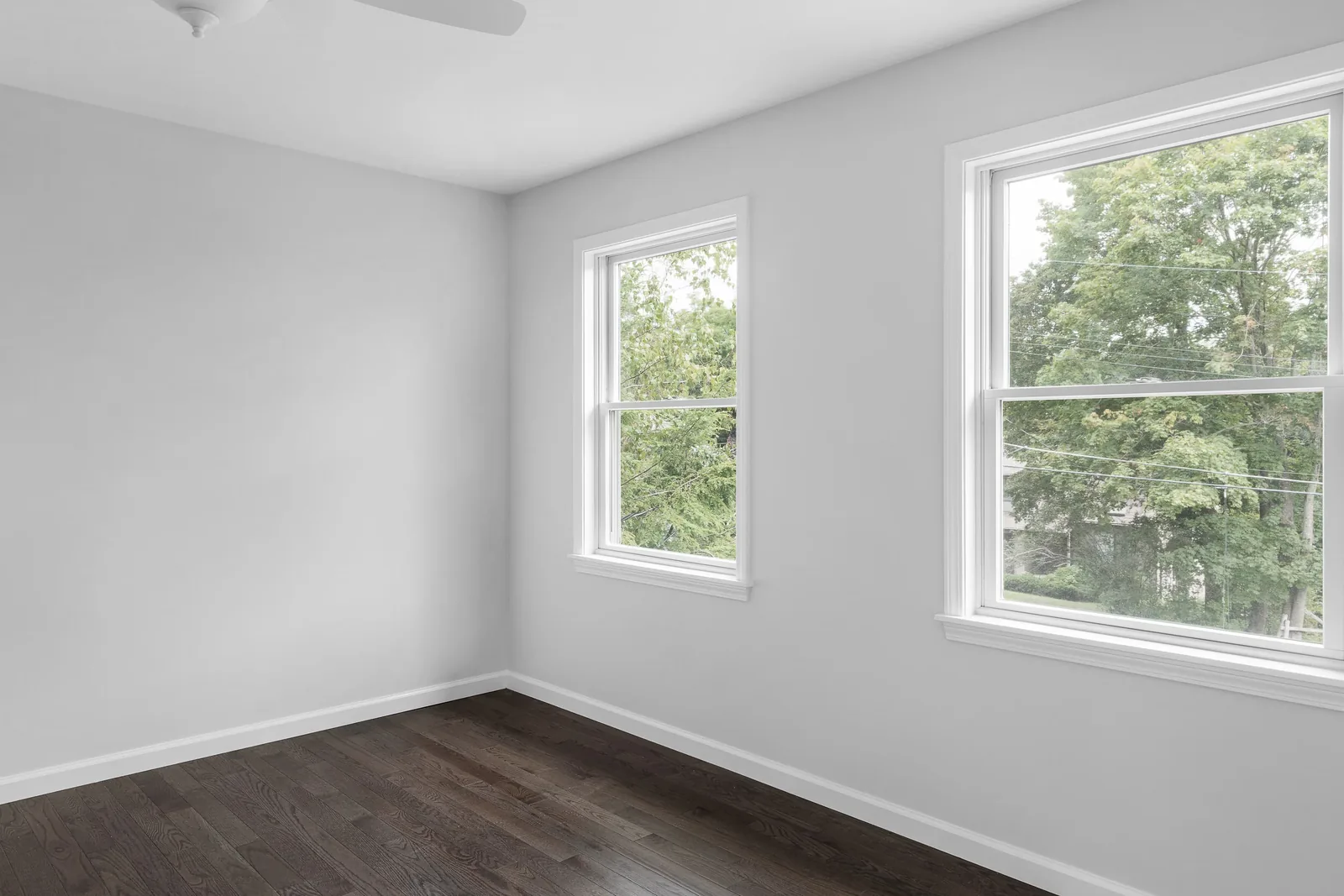 Bedroom with dark hardwood floors