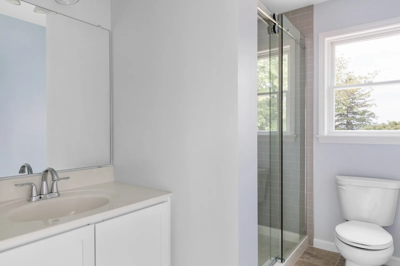 Bathroom with glass sliding shower door
