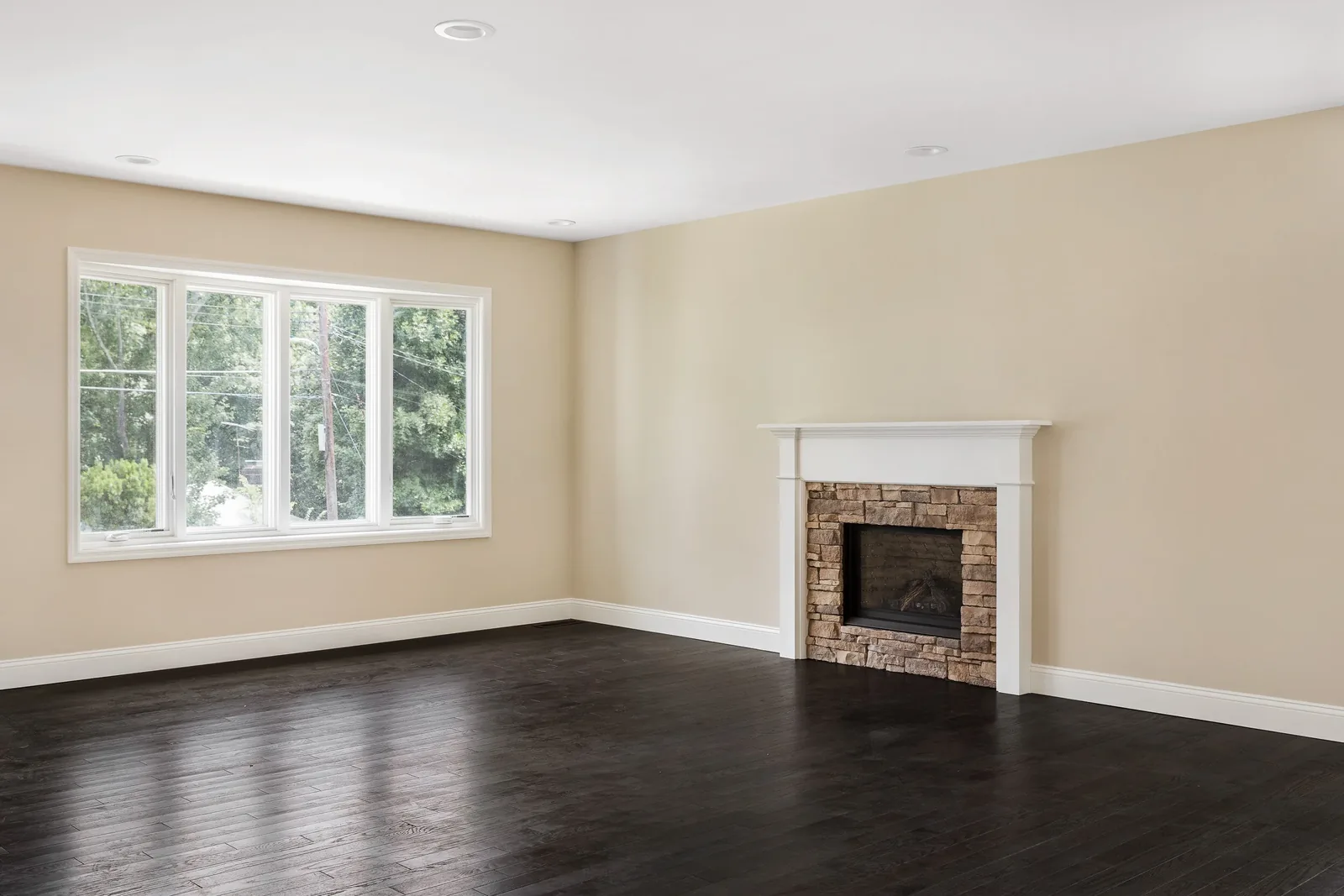 Living room with a stone fireplace