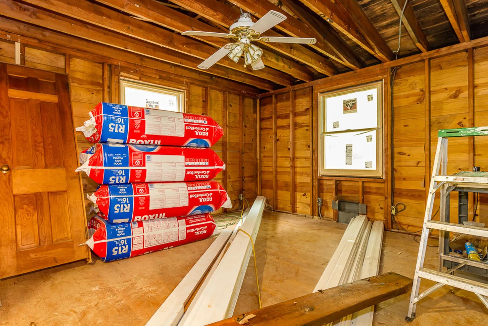 During construction: a room stripped to the studs with insulation ready