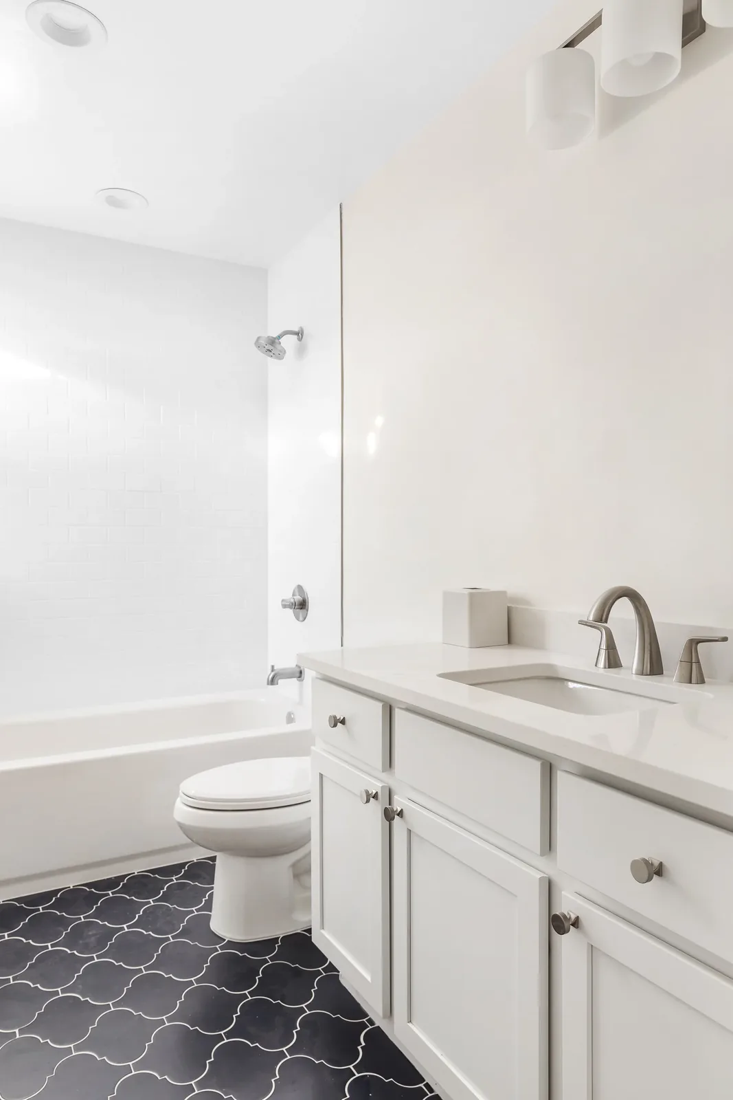 Bathroom with a new white vanity and quartz counter