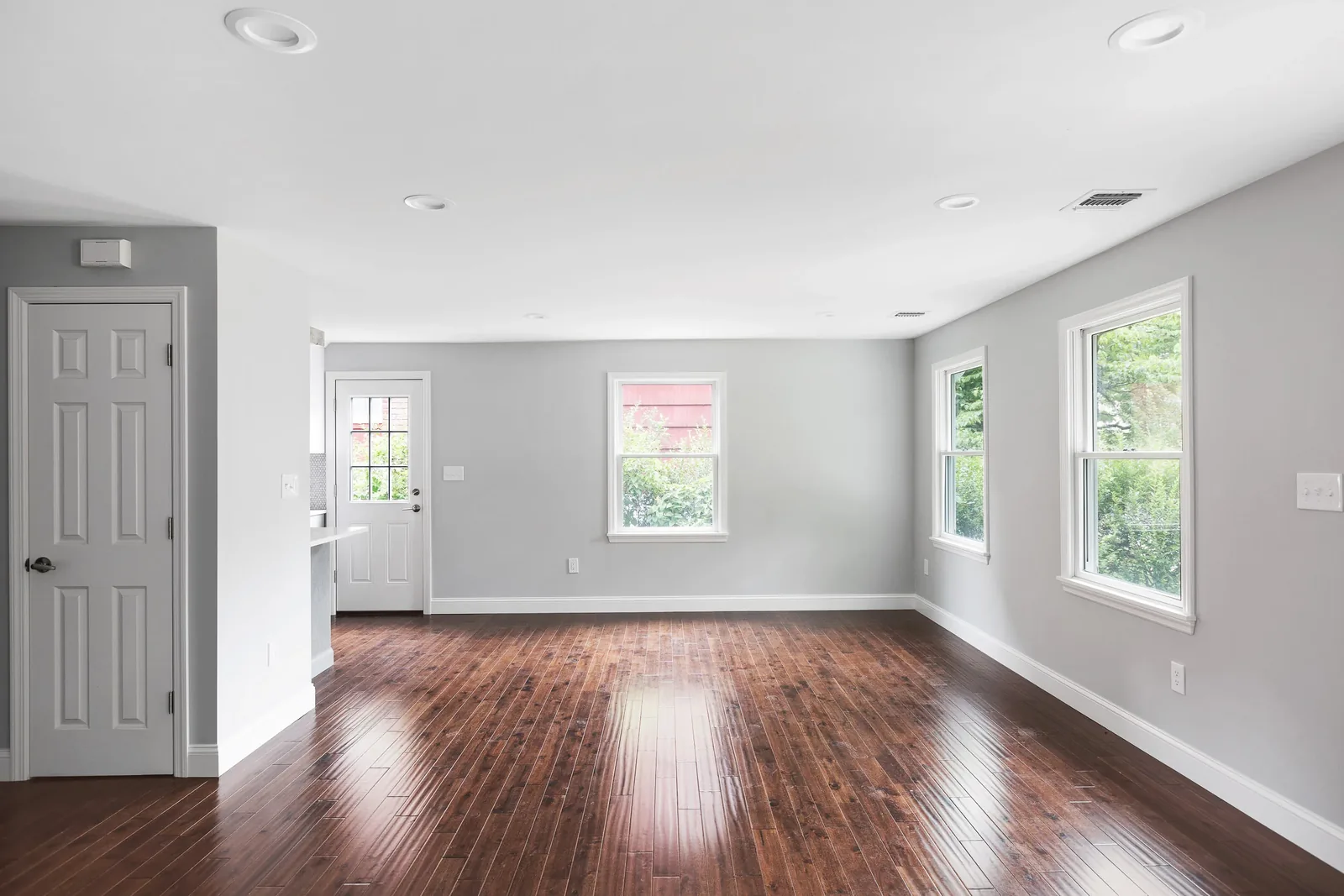 Living room with recessed lighting and hardwood floors