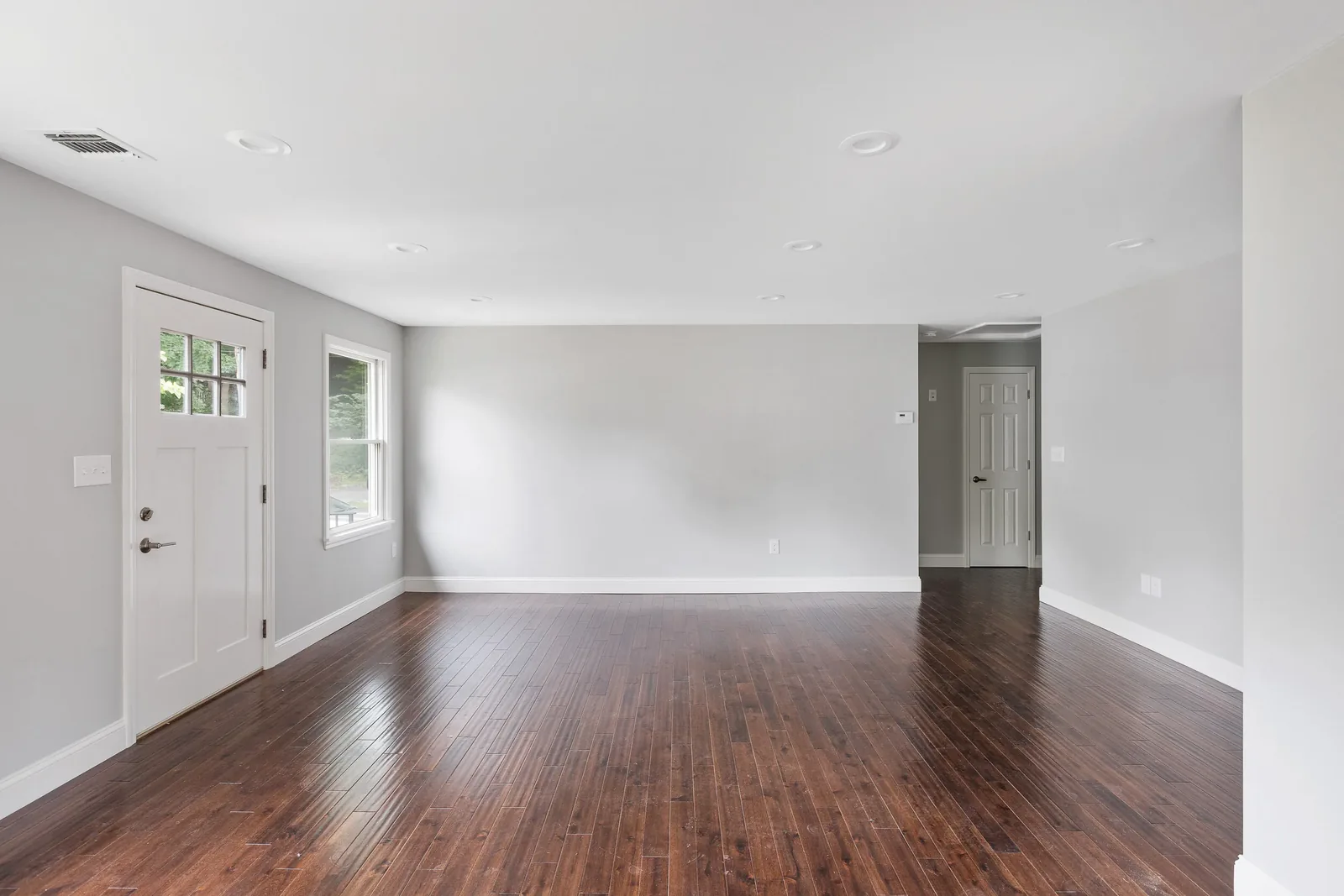 Open living space with dark hardwood floors