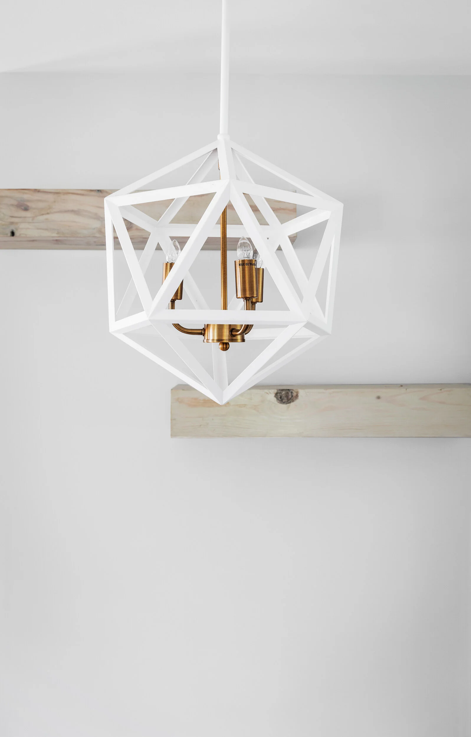 Geometric pendant with brass sockets and wood beams