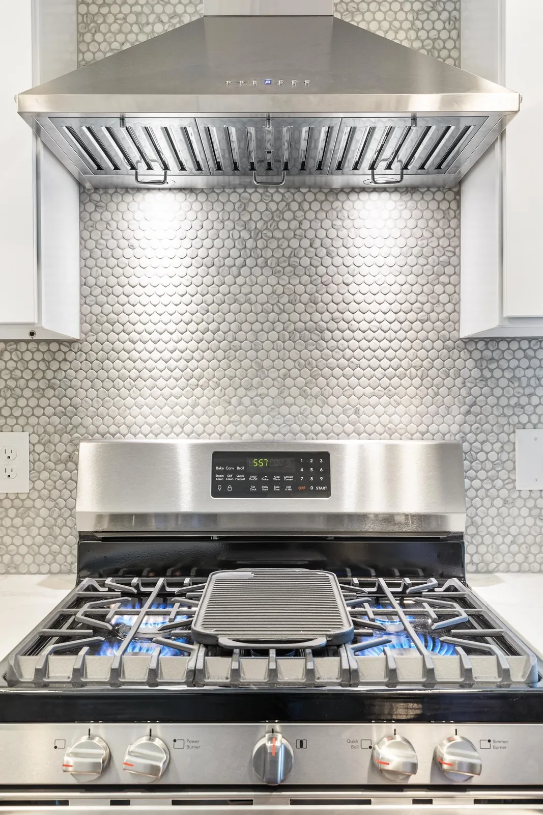 Gas range with chimney hood and penny-round tile