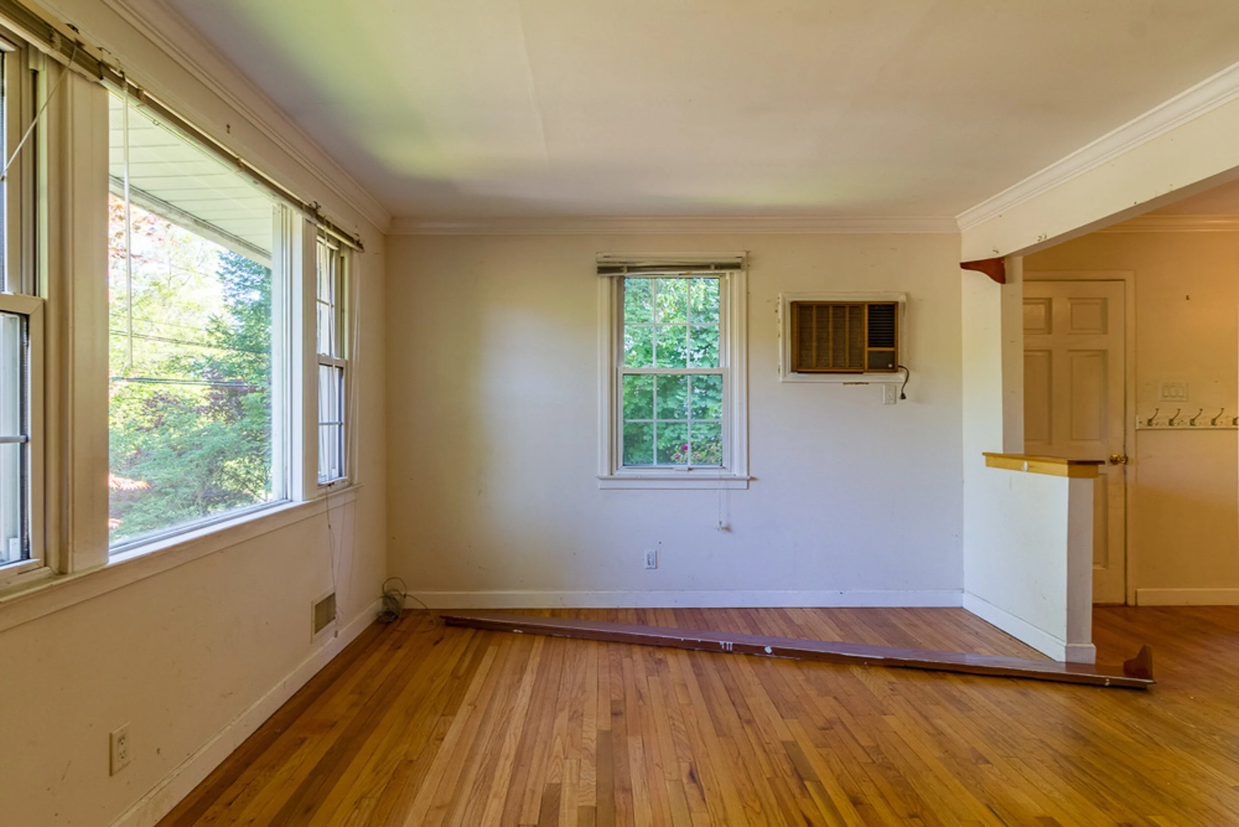 Before: living room with a window AC unit