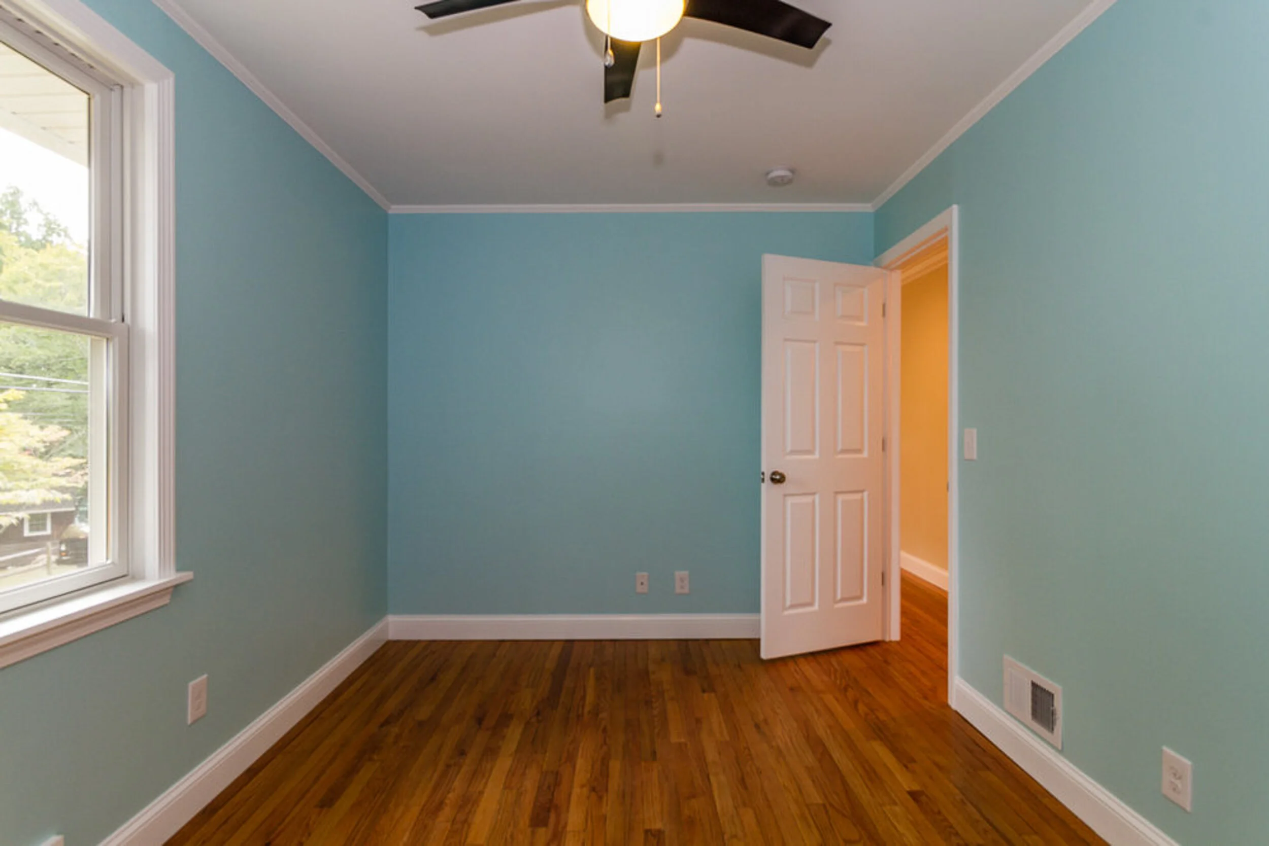 Bedroom with new paint and hardwood floors