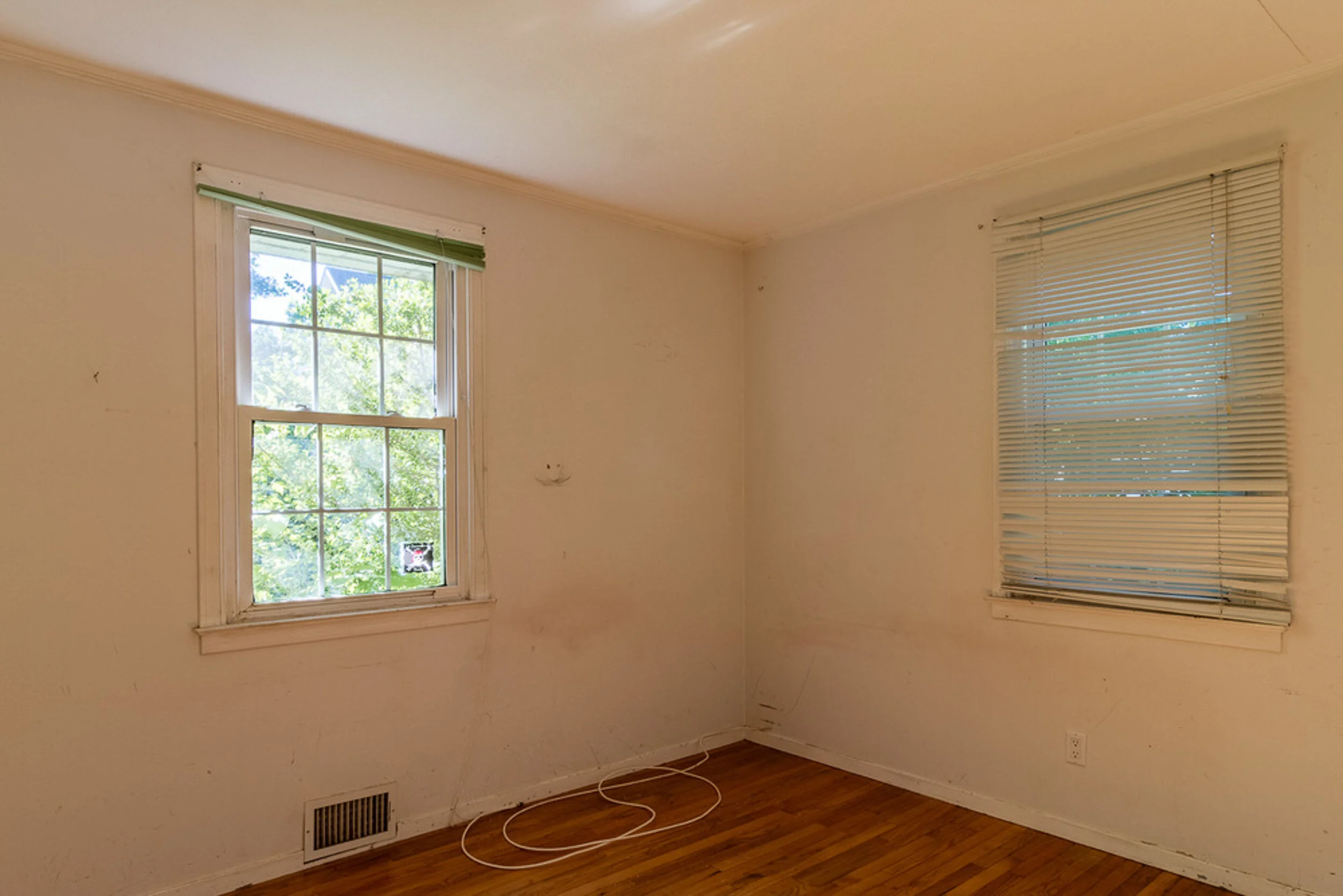Before: bedroom with worn walls