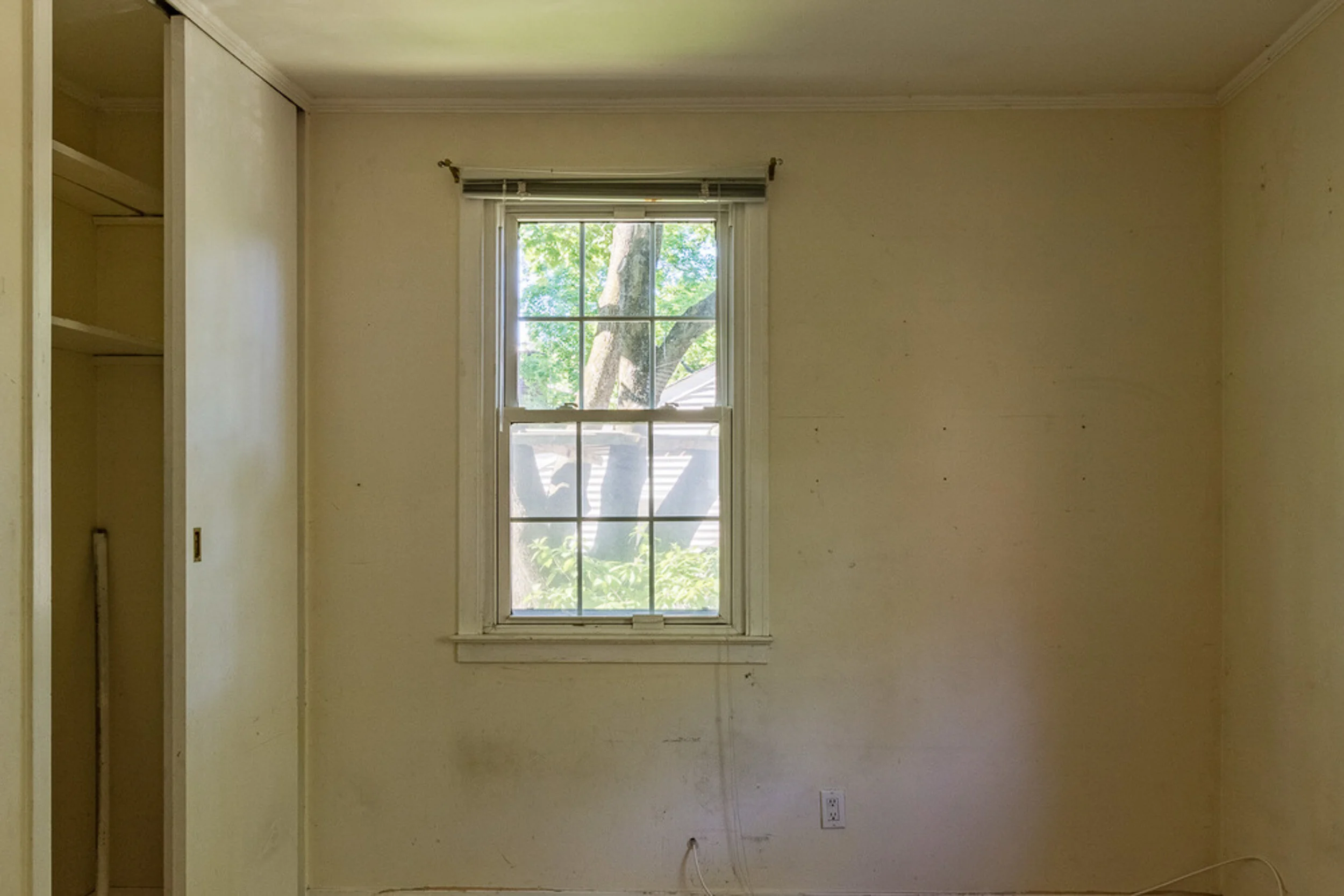 Before: bedroom with original closet
