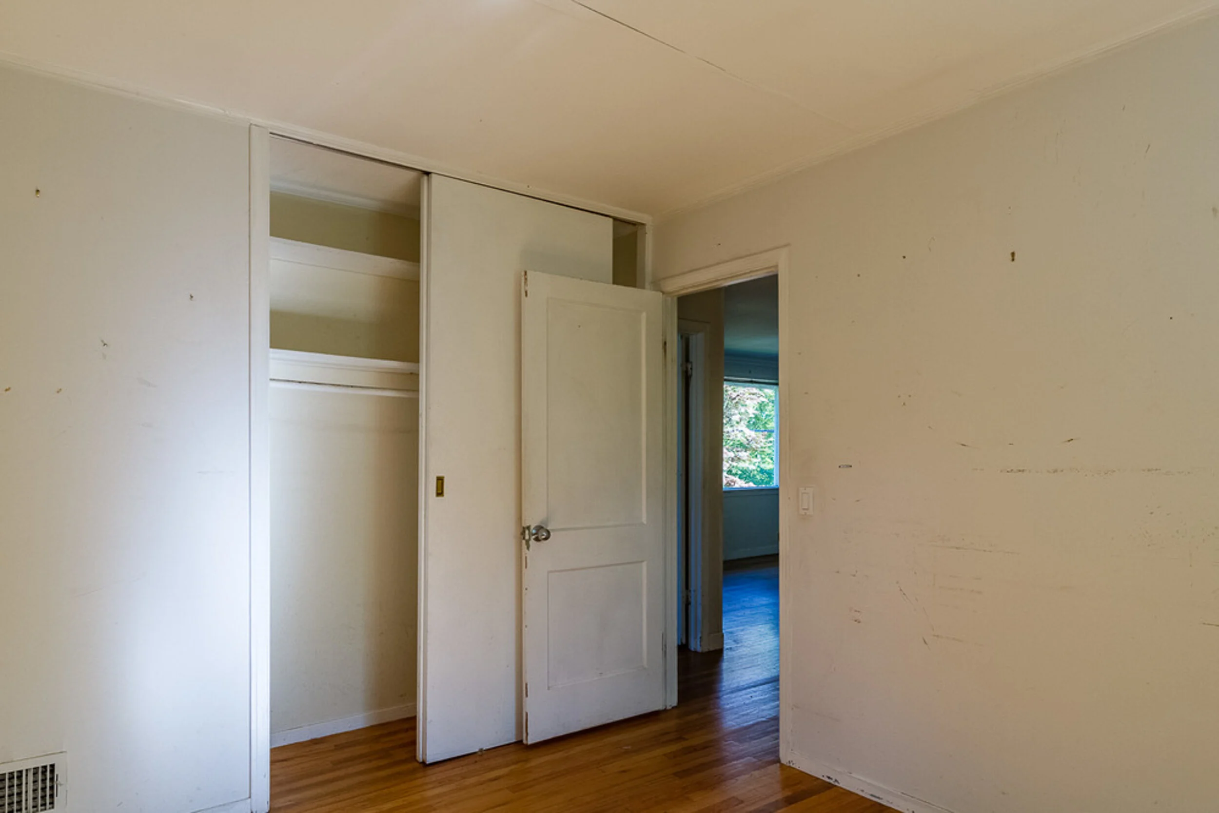 Before: bedroom closets and doors