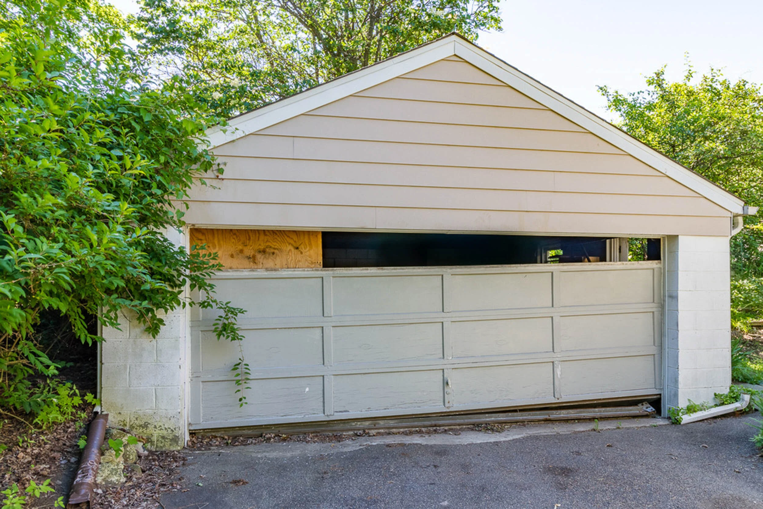Before: garage with failing door