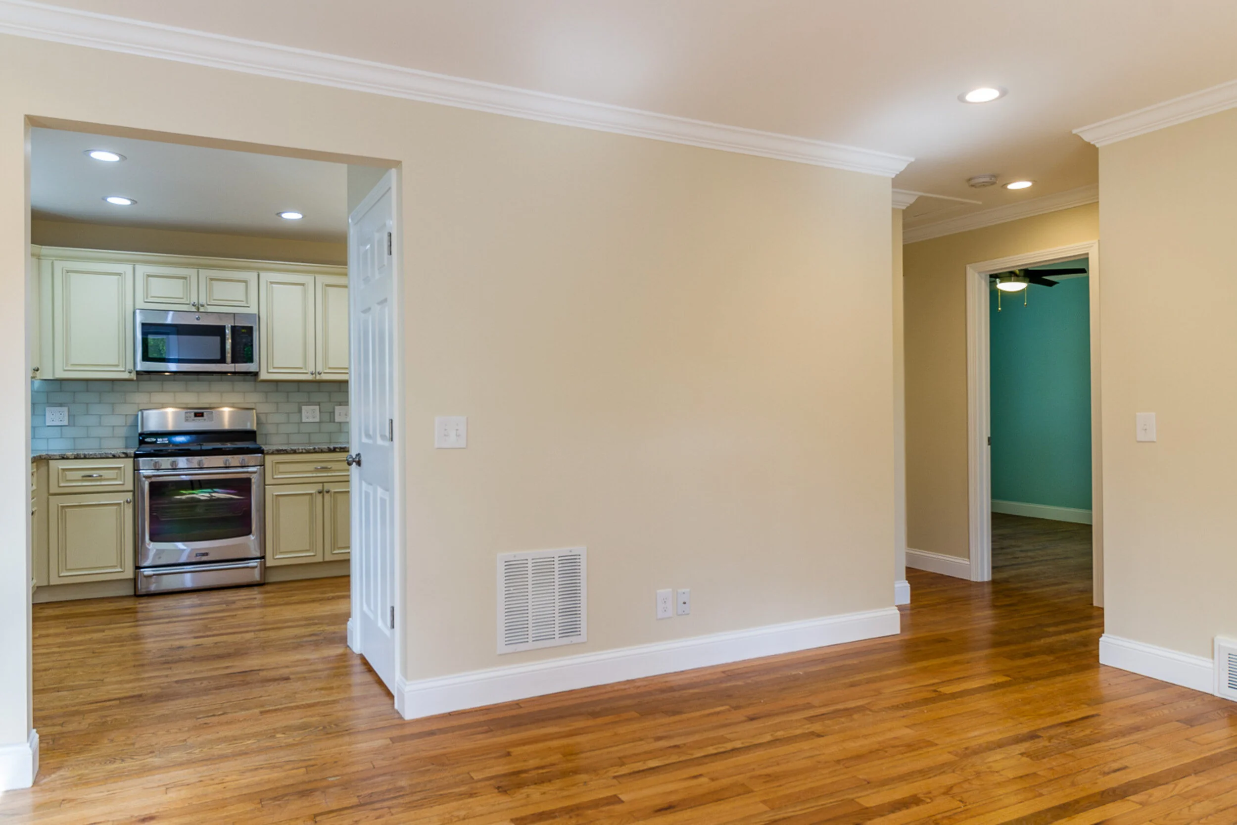 Kitchen with pendant light and door to the yard