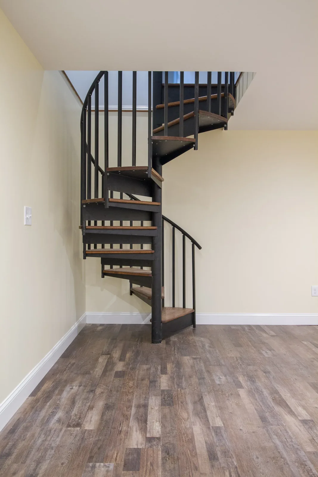 Spiral staircase to the finished basement