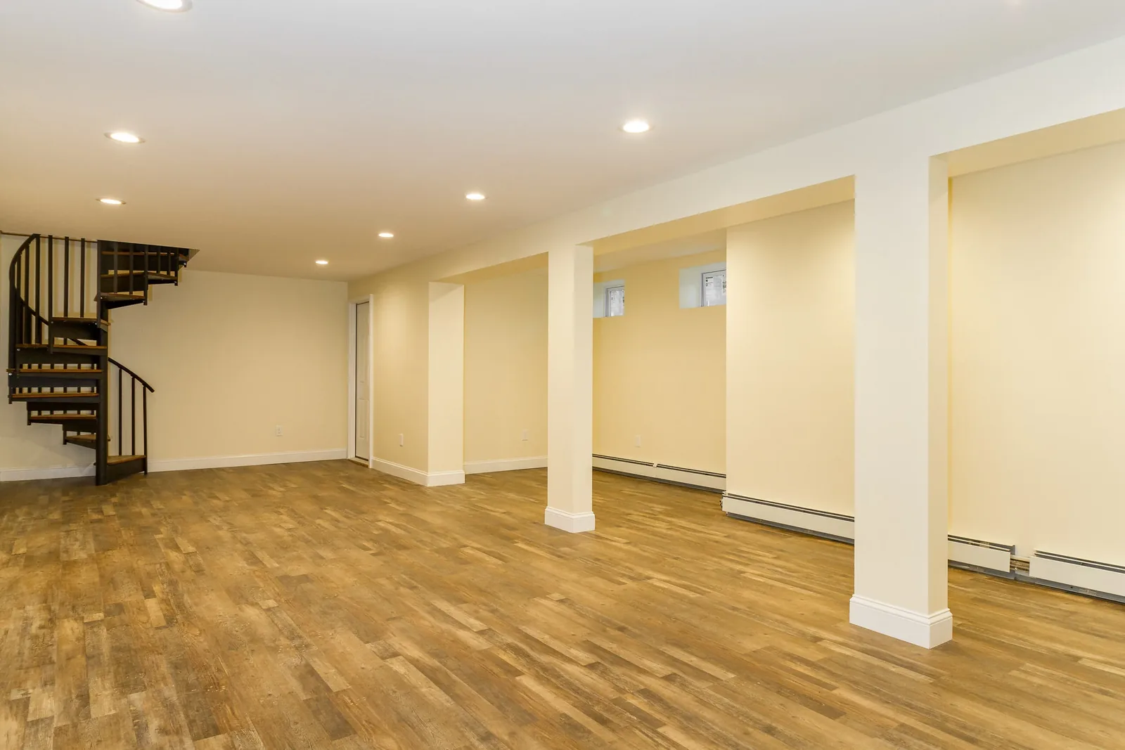 Finished basement with spiral staircase