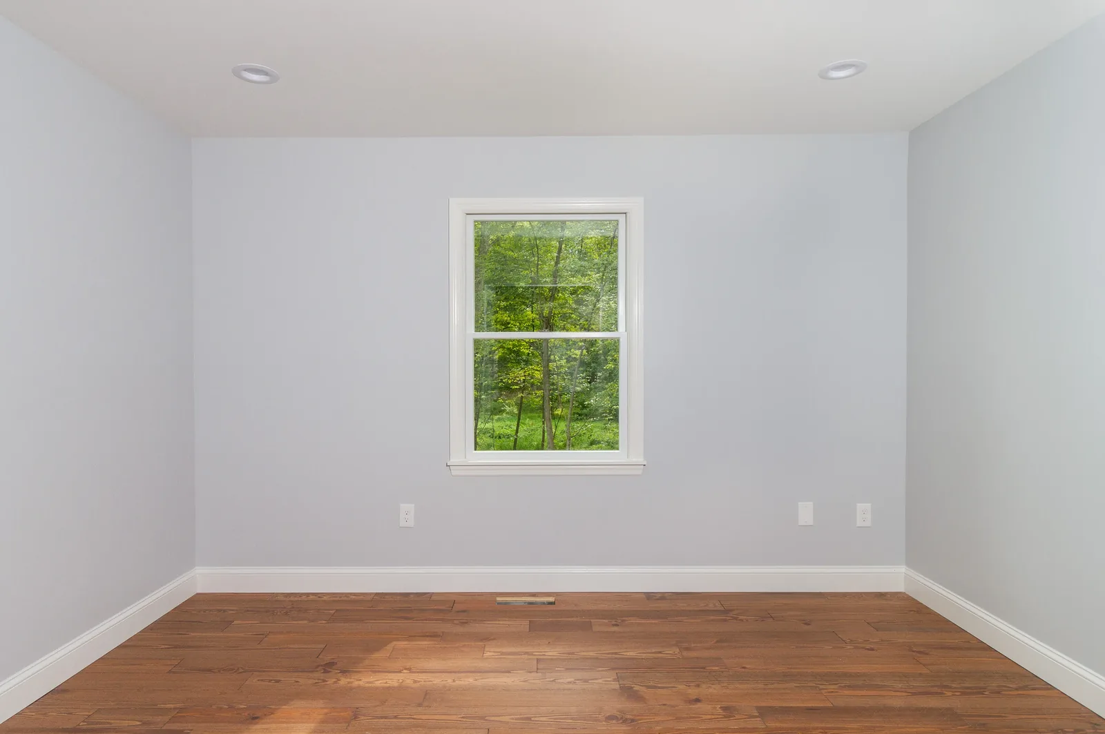 Bedroom with wooded views