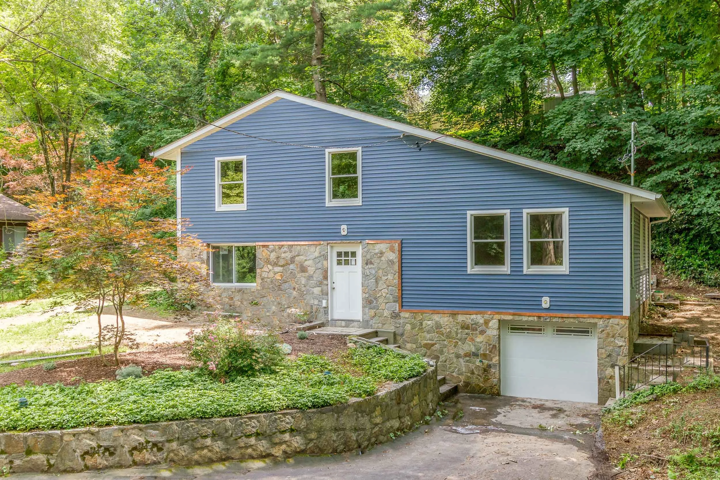Front exterior of the Quaker Bridge custom home