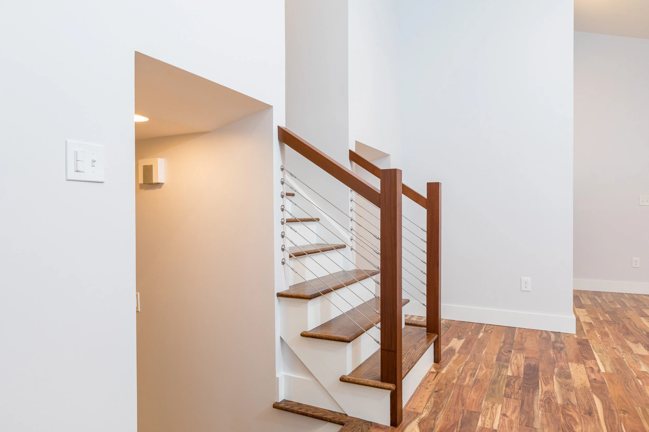 Wood staircase with cable railing