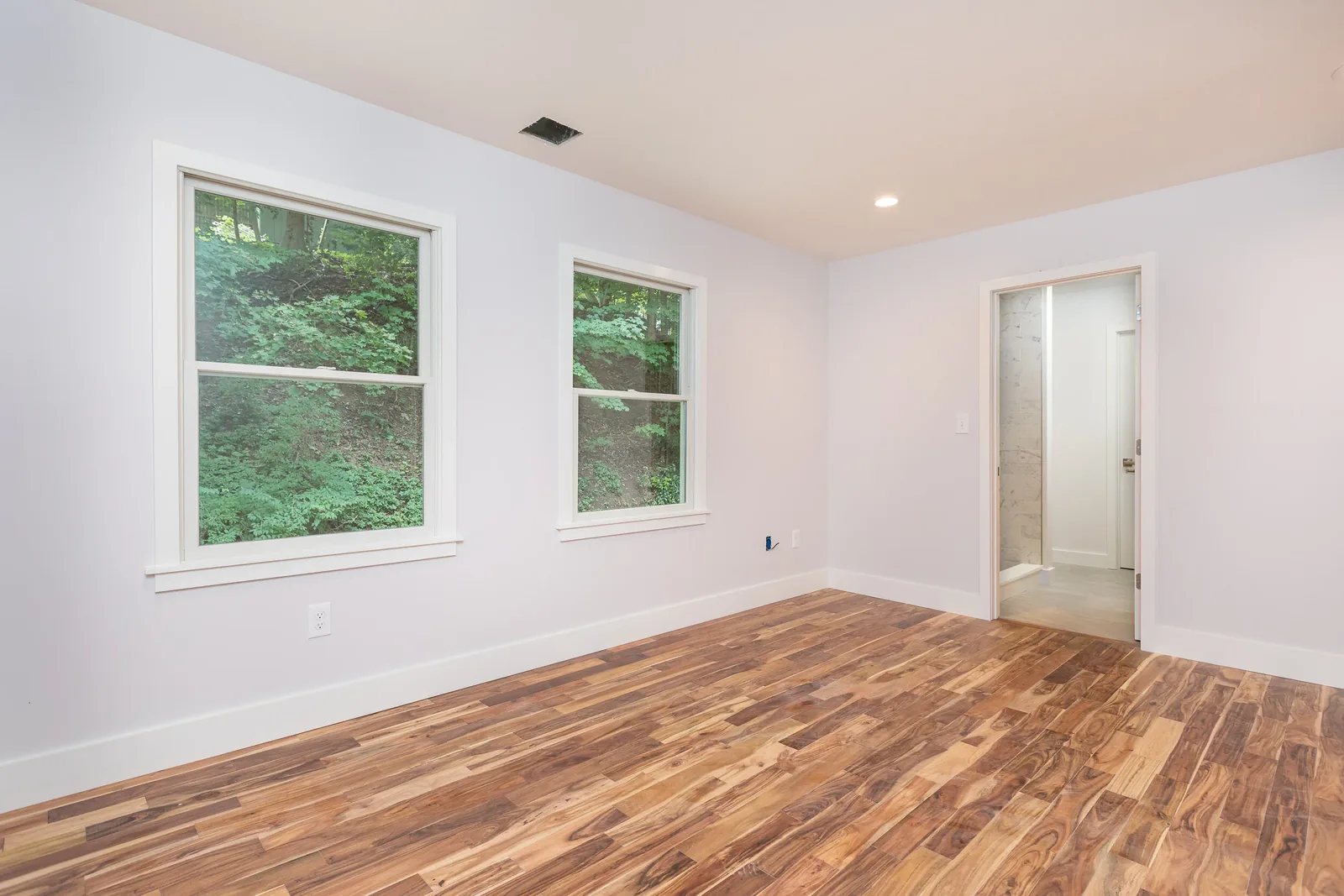 Bedroom with wooded views