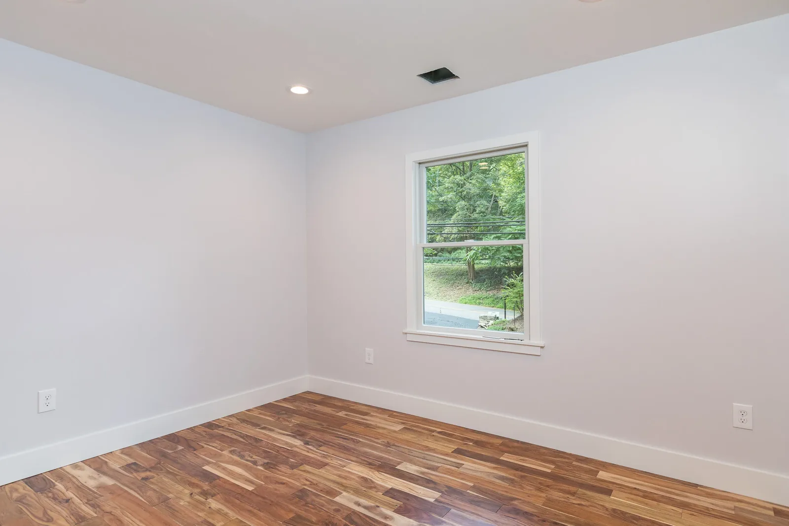 Bedroom with closet and window