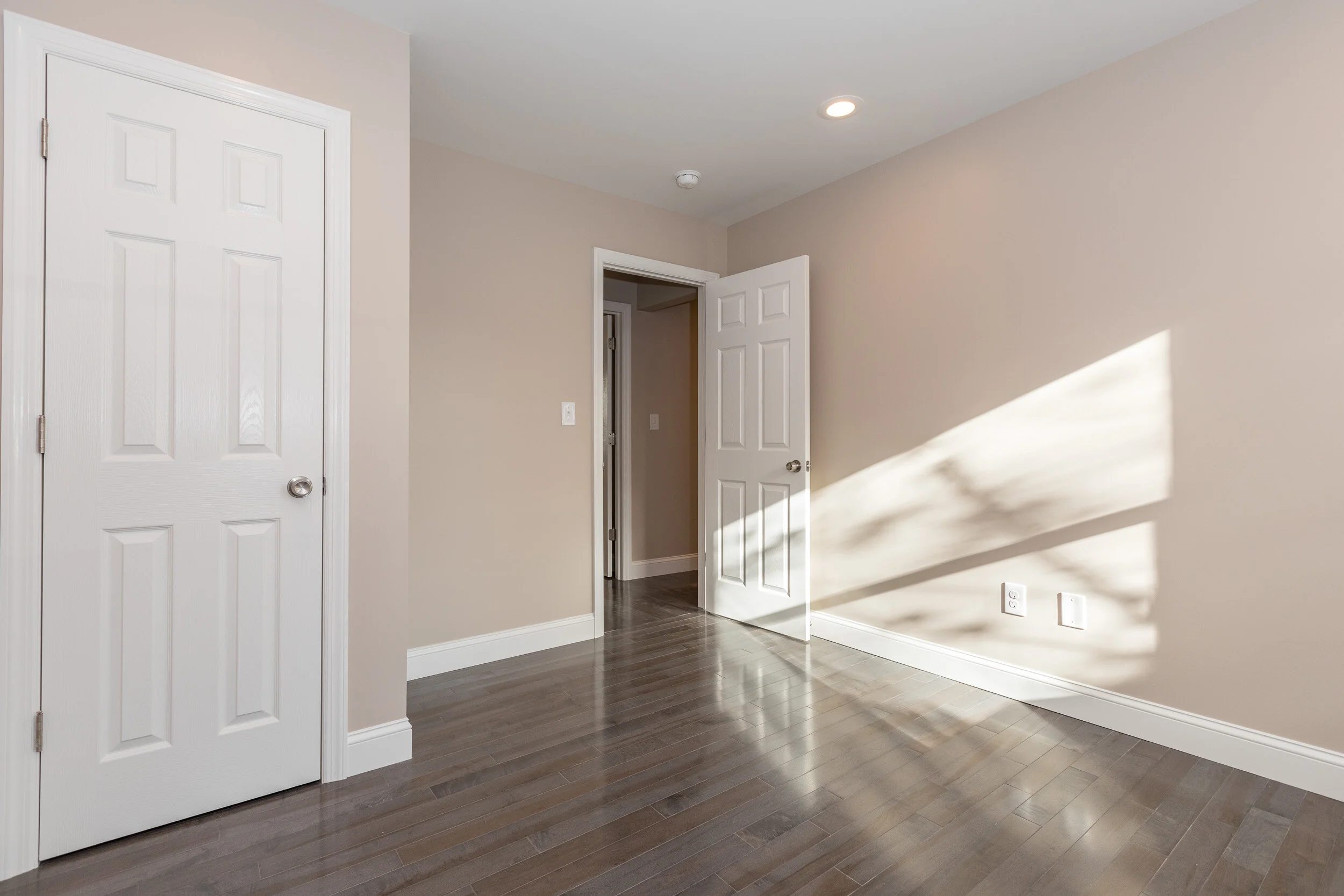 Hallway landing with paneled doors