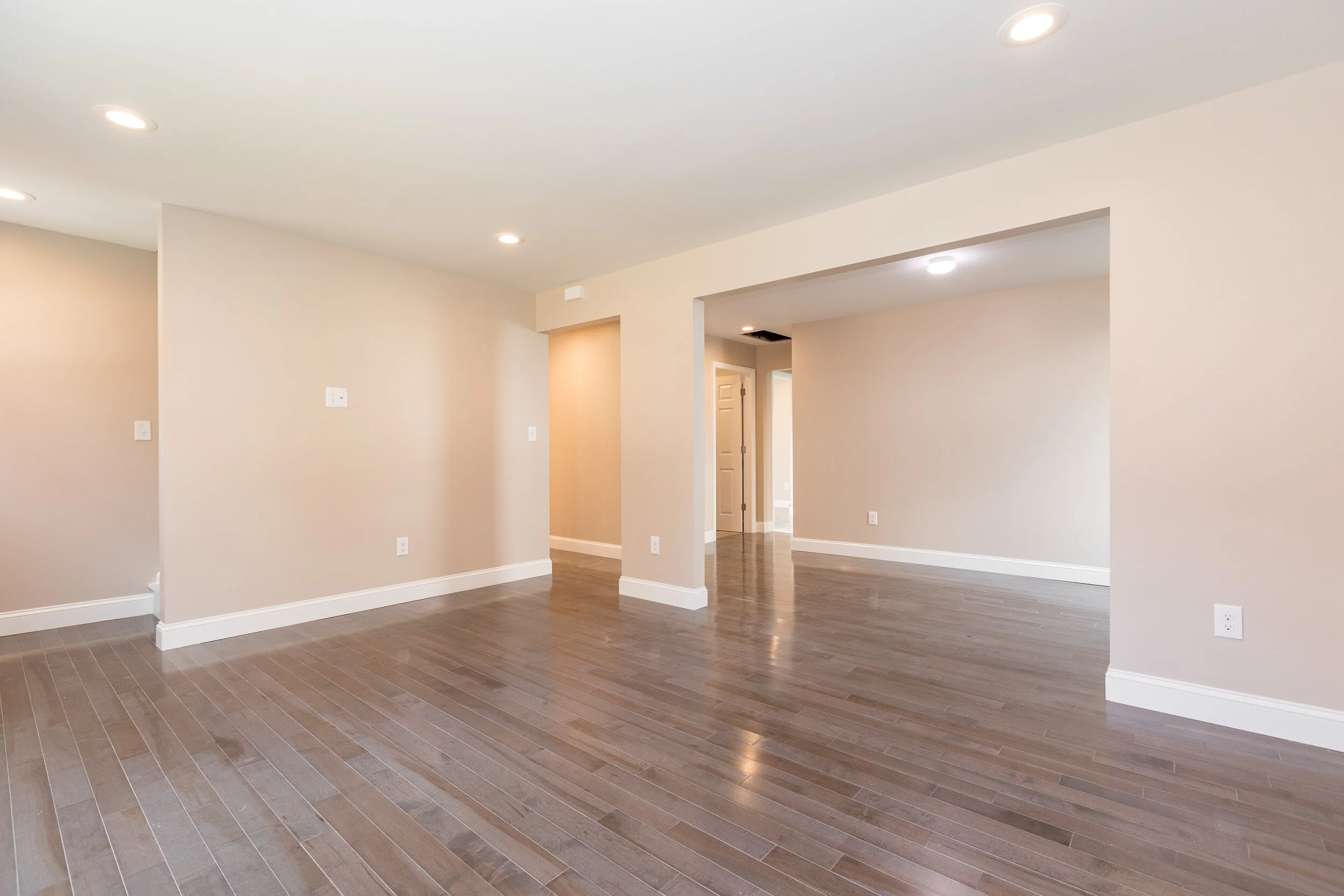 Open living and dining area with wide cased openings